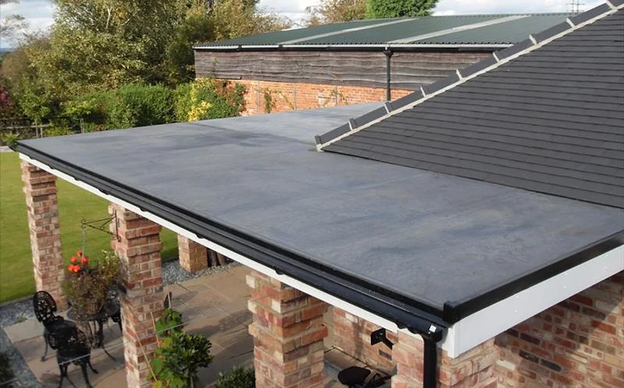 A genuine Newline flat roof — new rubber (EPDM) flat roof on a brick extension